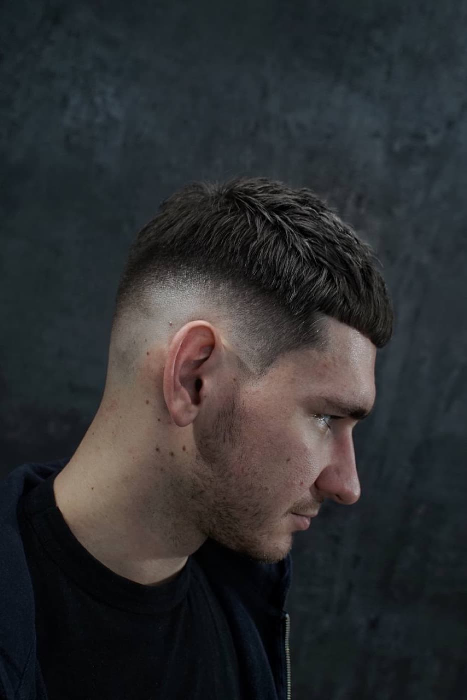 Textured crop haircut with a clean fade at MK Barbers Level UP